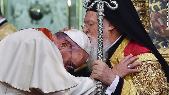 Ecumenical Patriarch Bartholomew I kisses the Pope during an ecumenical prayer at the Patriarchal Church of St. George in Istanbul on Saturday, November 29. 