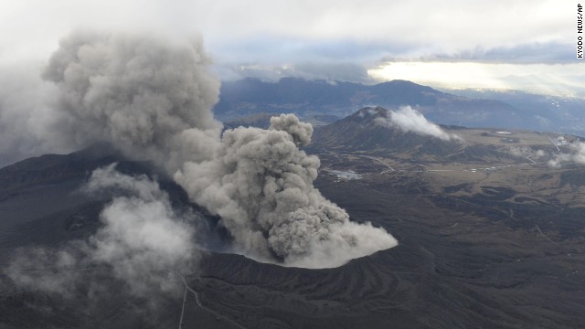 Volcanic smoke billows from Mount Aso on the southern Japanese island of Kyushu on Wednesday, November 26. The volcano is blasting out chunks of magma in its first eruption in 22 years, prompting flight cancellations and warnings to stay away from its crater.