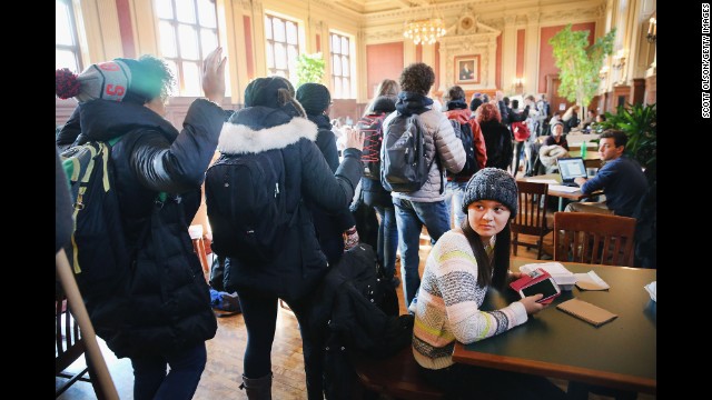 Washington University students march through a student lounge on the St. Louis campus as part of a nationwide walkout on Monday, December 1. Activists called for students to walk out of school and employees to walk off the job nationwide to protest police violence. A grand jury's decision not to indict Darren Wilson, a white police officer, in the August shooting death of unarmed black teenager Michael Brown has prompted demonstrations in Ferguson, Missouri, and across the country. <a href='http://www.cnn.com/2014/11/24/justice/gallery/ferguson-reaction/index.html'>See photos of the unrest in Ferguson.</a>