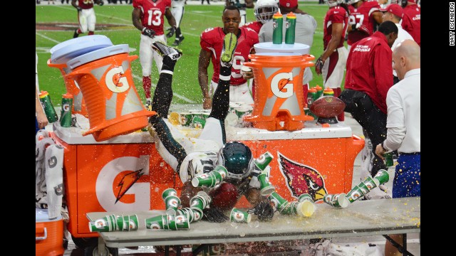 Philadelphia Eagles wide receiver Jeremy Maclin crashes through Gatorade after he was pushed out of bounds Sunday, October 26, in Glendale, Arizona.