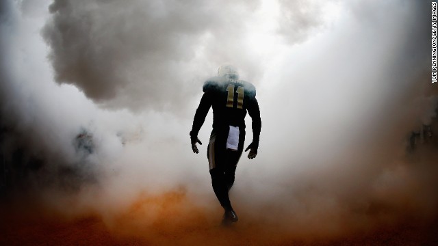 Baylor linebacker Taylor Young walks through artificial smoke before the Bears took on TCU at Baylor's McLane Stadium on Saturday, October 11.