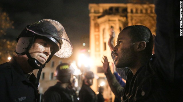 Protesters face off with police in Oakland.