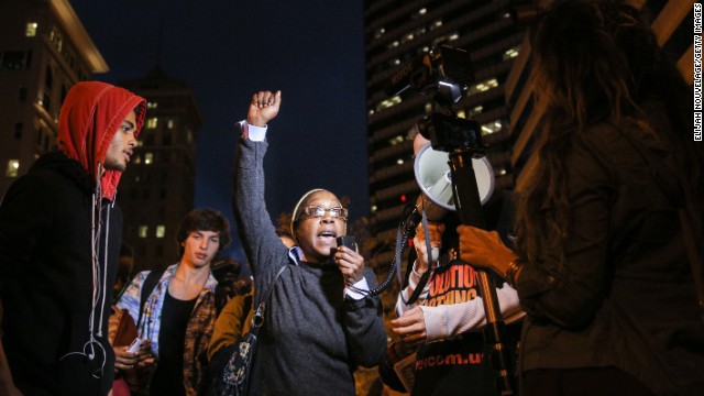 A woman speaks during a demonstration in Oakland on December 3.