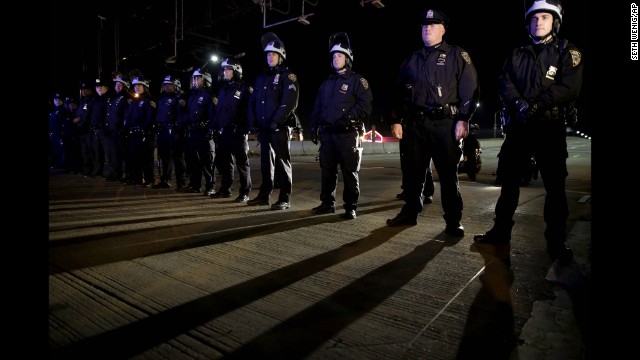 Police officers stand guard in New York's Times Square on December 3.