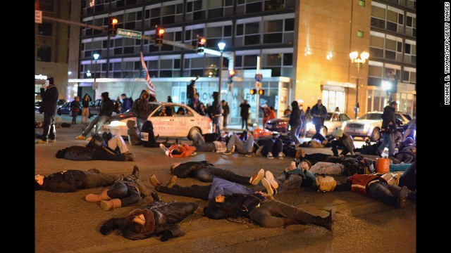 Demonstrators lie in the streets of St. Louis on December 3.