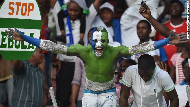 Football is "like a second religion in Sierra Leone." That was before the Ebola outbreak put a stop to organized games, casual kick-abouts, and people gathering to watch the national sport. Here, a fan shows his colors. 