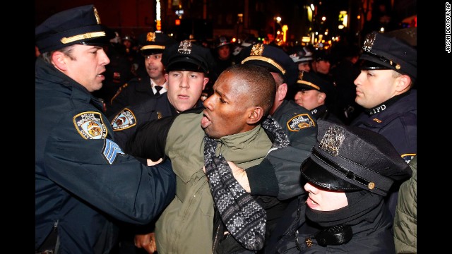 Police make an arrest as protesters march through Manhattan early on December 5. 