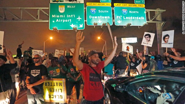 Protesters shut down all eastbound and westbound lanes on Interstate 195, which links Miami Beach to the mainland, on Friday, December 5. 