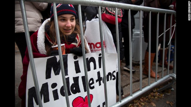 Lauren Nichols, of Chardon, Ohio, huddles in the cold while she waits to see the duchess December 8 in New York.