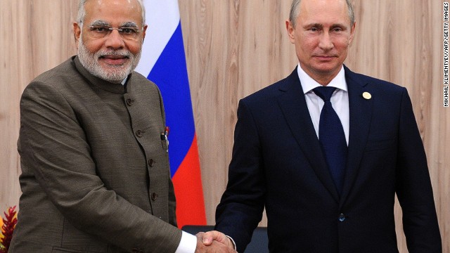 India's PM Narendra Modi meets Russia's President Vladimir Putin at the BRICS group leaders summit in Brazil, on July 16, 2014. 