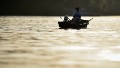 A man fishes off a boat on the Tisa river near the Serbian town of Kanjiza, 200 kilometres north of the capital Belgrade, on June 11, 2014, as temperatures in Serbia reached levels above average. AFP PHOTO / ANDREJ ISAKOVIC (Photo credit should read ANDREJ ISAKOVIC/AFP/Getty Images)