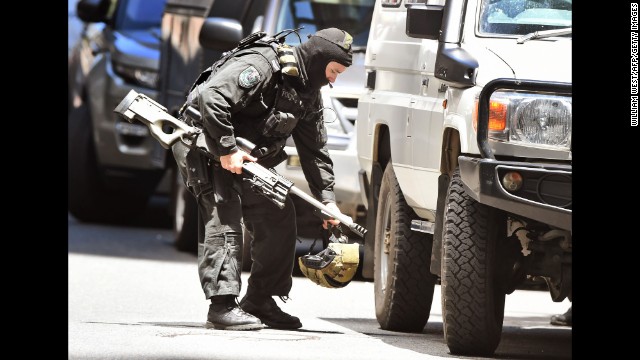 A police sniper walks to his vehicle on December 15.