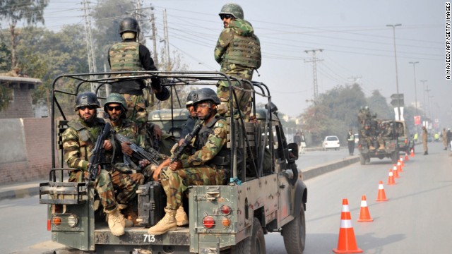 Pakistani troops reach the site of the attack.