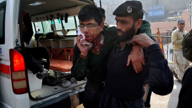 A hospital security guard helps an injured student at the school.