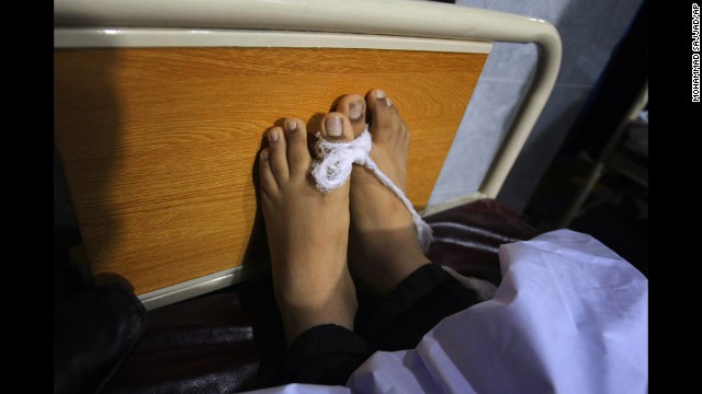 The body of a victim lies at a hospital in Peshawar on December 16.
