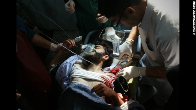 A wounded student receives treatment at a Peshawar hospital.