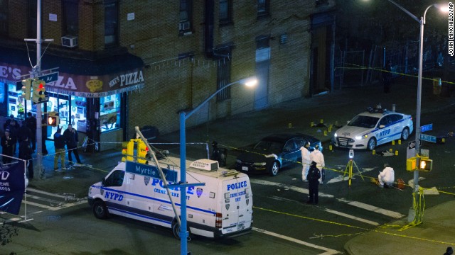 The officers were shot and killed ambush-style Saturday afternoon as they sat in their patrol car in Brooklyn, officials said.
