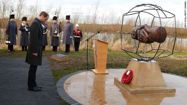 Prince William takes a moment to remember those who fought in WWI in front of the memorial designed by 10 year-old Spencer Turner from Newcastle. 