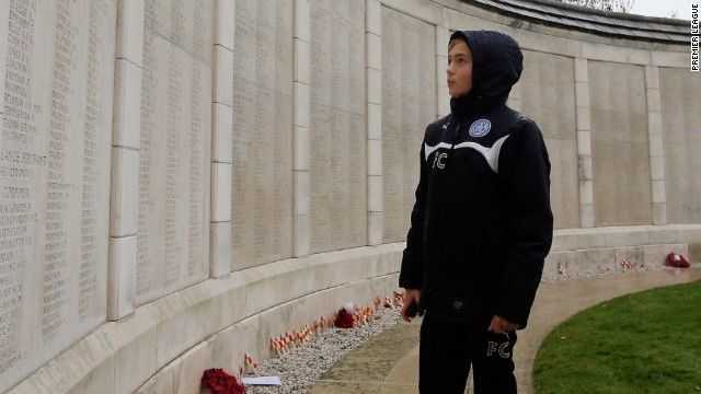 One of the young players takes time to read the names on the Menin Gate at Ypres. Clubs from 10 European countries took their teams to the tournament where they learned about the history of the First World War.