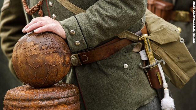  A participant wearing the uniform of WWI soldiers poses in Belgium during the inauguration of a monument to commemorate those of opposite camps who are reported to have played a game during the 1914 truce.