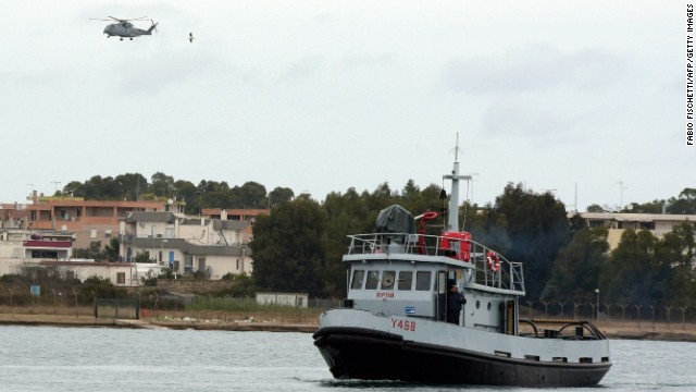 An Italian Navy helicopter and a rescue unit leave the port of Brindisi to take part in the rescue operations.