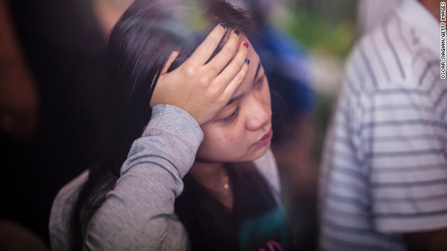 Family members of passengers wait for news at the crisis center at Djuanda International Airport in Surabaya, Indonesia, on December 29.