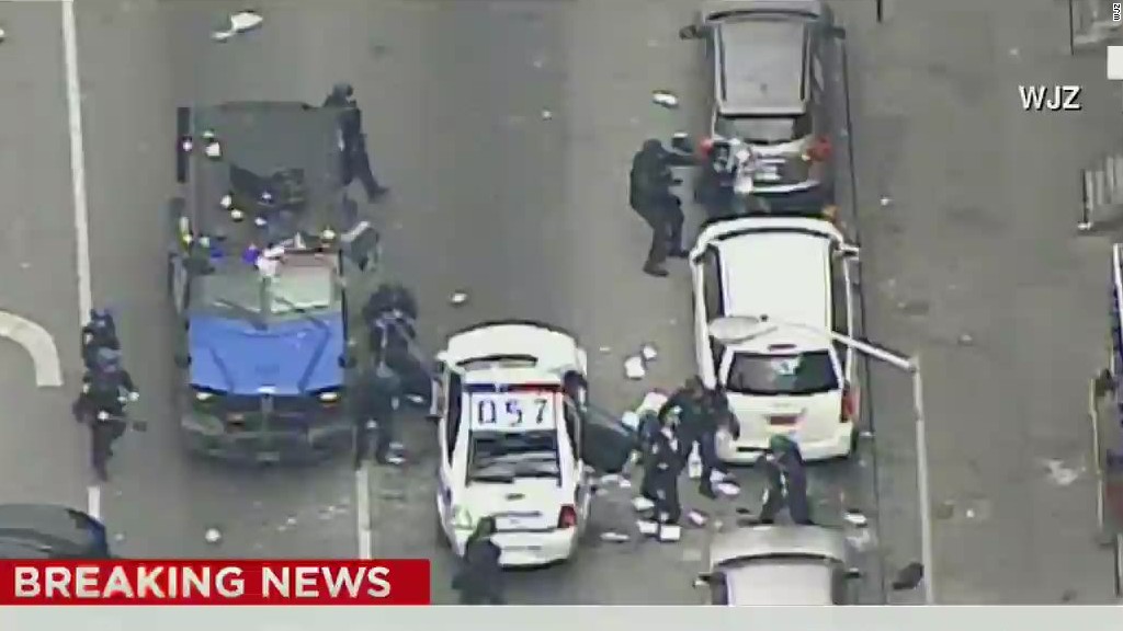 Riot in Baltimore: 15 officers injured, two dozen people arrested.