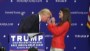 Is it real? Trump asks woman to touch his hair