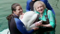 Betty White splashes with beluga whale