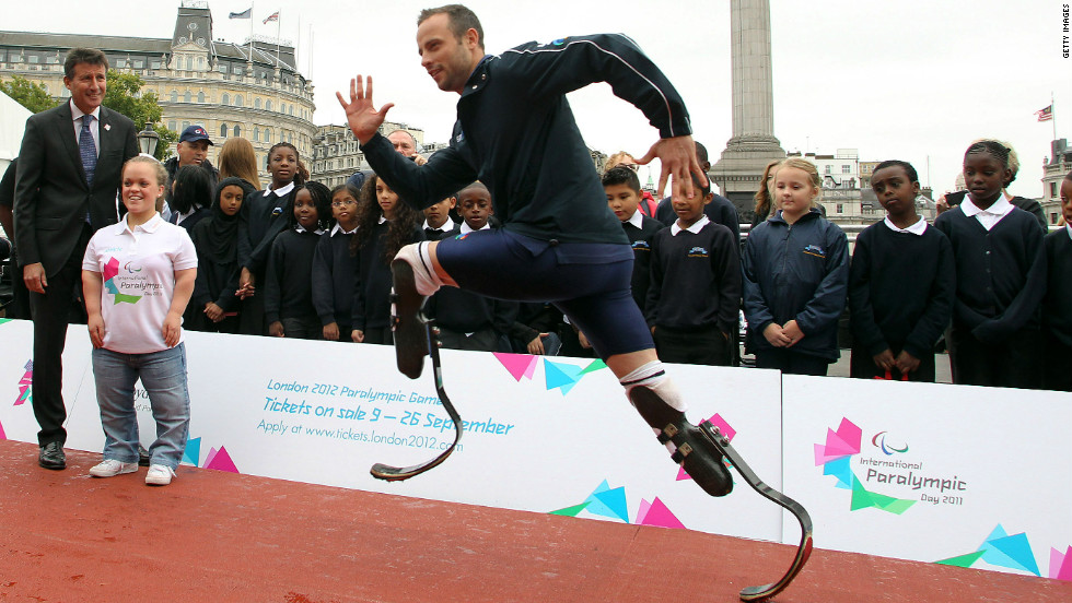 Pistorius demonstrates his sprinting skills to London Olympic chief Sebastian Coe at an event to launch the 2012 Paralympic Games.
