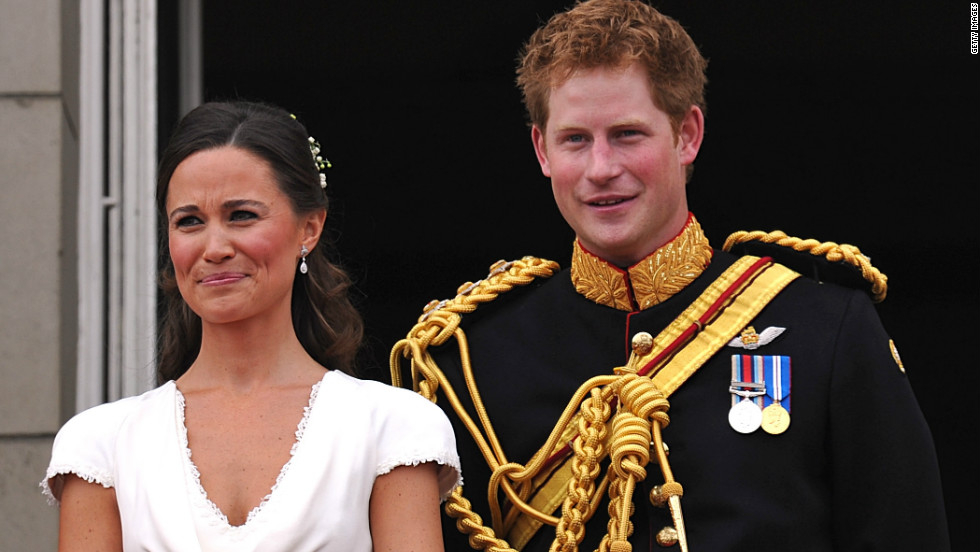 Best man Prince Harry and Maid of Honour Pippa Middleton appear on the balcony at Buckingham Palace after the royal wedding of Prince William to Catherine Middleton on April 29, 2011.