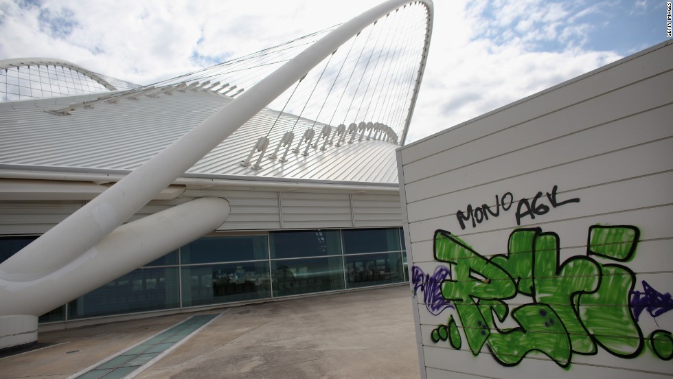 Graffiti marred the velodrome building in the 2004 Olympic Games Complex in February 2012 in Athens, Greece. What was once viewed as a triumph for Greece is seen as having played a role in the country&#39;s economic nosedive.