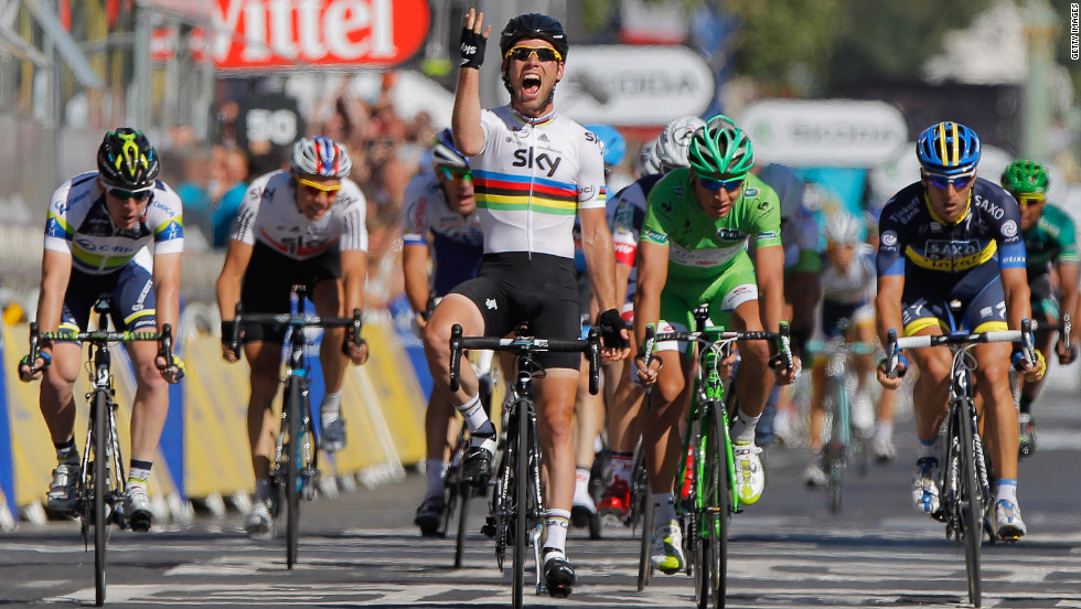 Mark Cavendish wins the stage on the Champs Elysees in 2012, his fourth straight in the French capital. He is hoping to wear yellow for the first time by taking the first stage in Normandy.