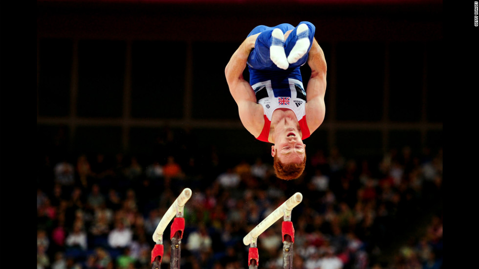 British gymnast Daniel Purvis performs on the artistic gymnastics men's parallel bars.