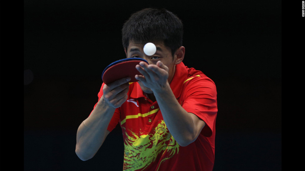Zhang Jike of China serves during the men's singles table tennis quarter-final match against Tianyi Jiang of Hong Kong on Wednesday.