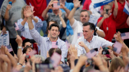Mitt Romney and vice presidential candidate and Wisconsin native Rep. Paul Ryan (R-WI) (L) greet supporters during a campaign event at the Waukesha Expo Center on August 12, 2012 in Waukesha, Wisconsin.