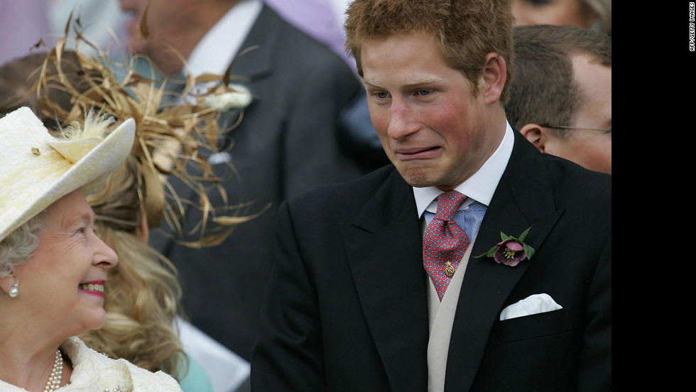Britain&#39;s Queen Elizabeth II and Prince Harry share a joke as they watch Prince Charles and his bride Camilla Duchess of Cornwall leave St. George&#39;s Chapel in Windsor, England, following their marriage blessing on April 9, 2005.