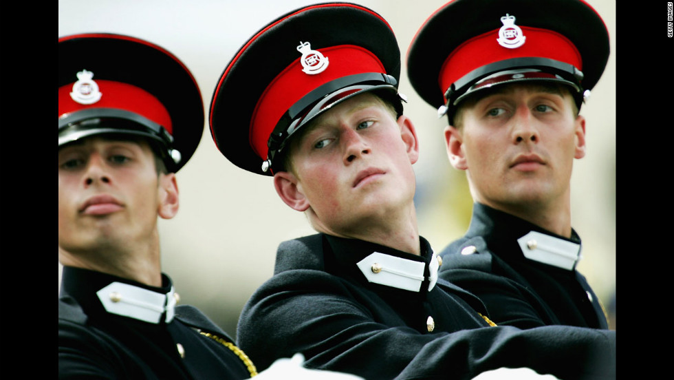 Prince Harry takes part in the Trooping Of New Colours alongside his fellow officer cadets at the Royal Military Academy on June 21, 2005, in Sandhurst, England.