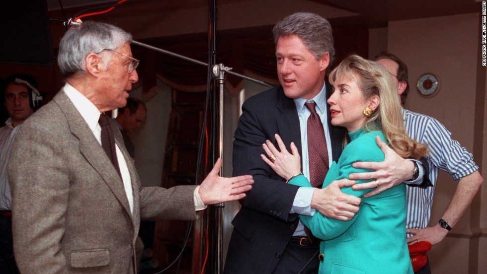 Bill Clinton embraces his wife
shortly after a stage light fell near her on January 26, 1992. They talk to
Don Hewitt, producer of the CBS show &quot;60 Minutes.&quot;