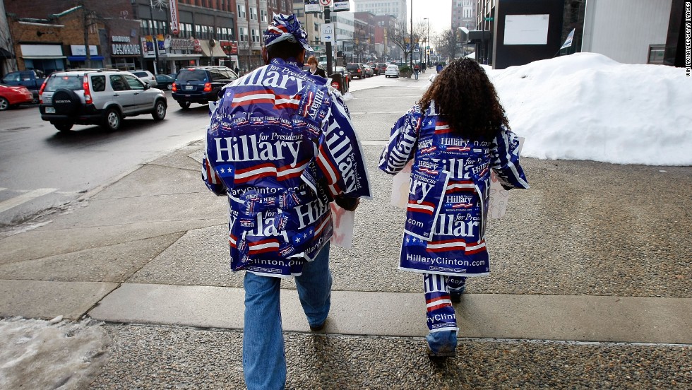 Felipe Bravo, left, and Christian Caraballo are covered
with Hillary Clinton stickers in downtown Manchester, New Hampshire, on
January 8, 2008.