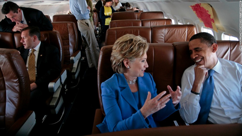 Obama and Clinton talk on the plane on their way to a Unity Rally in Unity, New Hampshire, on June 27, 2008.