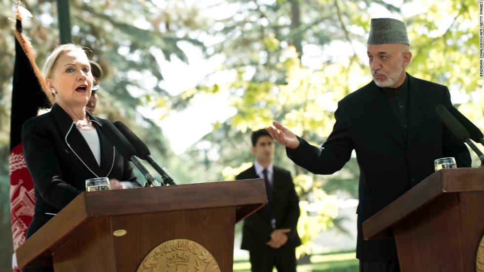 Clinton speaks as Afghanistan President Hamid Karzai listens during a news conference at the presidential palace in Kabul, Afghanistan, on July 7, 2012.