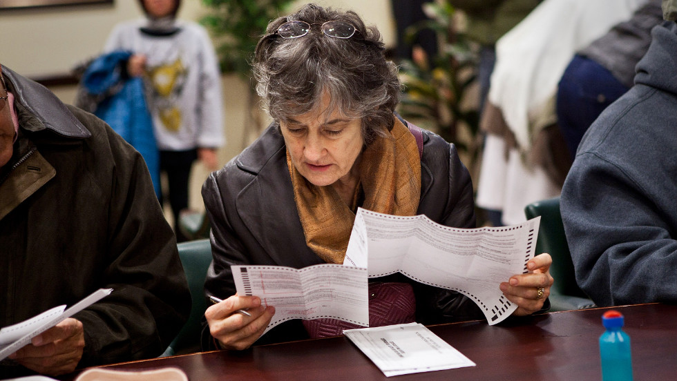 A woman fills out an early voting ballot on Sunday, November 4, in Jersey City, New Jersey. Gov. Chris Christie ordered early voting stations to stay open through the weekend in an effort to get people to vote despite the damage done by Superstorm Sandy.