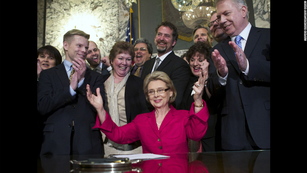 Washington Gov. Chris Gregoire celebrates after signing marriage-equality legislation into law on February 13, 2012. Voters there approved same-sex marriage in November 2012.