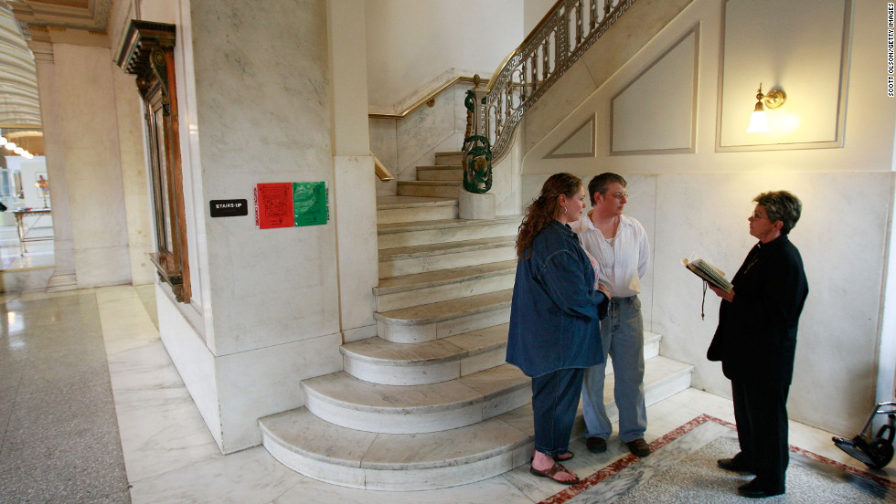 Amy Klein-Matheny, left, and her wife, Jennifer, exchange vows in Iowa after same-sex couples were allowed to marry there with a court ruling in April 2009.