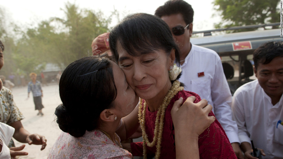 <strong>April 1: </strong>A supporter kisses Aung San Suu Kyi, leader of the National League for Democracy, as she visits polling stations in her constituency as Burmese vote in parliamentary elections in Kawhmu, Myanmar. She won a seat in parliament in Myanmar's first multiparty elections since 1990.