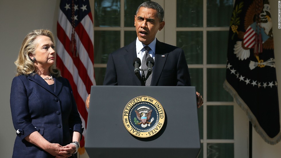 Clinton looks on as Obama makes a statement in response to the attack at the U.S. Consulate in Libya on September 12, 2012.