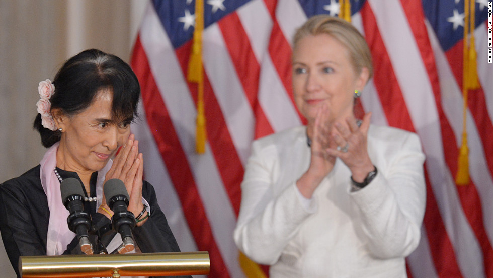 Clinton applauds Myanmar opposition leader Aung San Suu Kyi during a ceremony where Suu Kyi was presented with the Congressional Gold Medal on September 19, 2012.