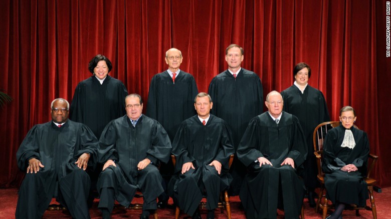 The justices of the U.S. Supreme Court sit for their official photograph on October 8, 2010, at the Supreme Court. Front row, from left: Clarence Thomas, Antonin Scalia, Chief Justice John G. Roberts, Anthony M. Kennedy and Ruth Bader Ginsburg. Back row, from left: Sonia Sotomayor, Stephen Breyer, Samuel Alito Jr. and Elena Kagan. Scalia was found dead on February 13 at a Texas ranch he was visiting.