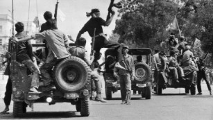 Khmer Rouge forces drive through Phnom Penh on 17 April, 1975.